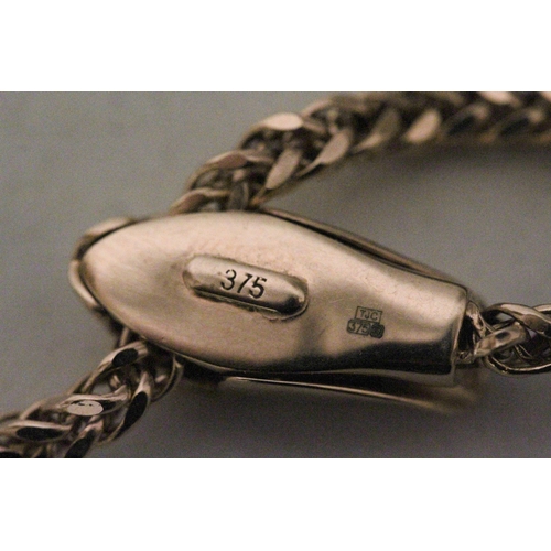 572 - A modern 9ct rose gold snake necklace, the fancy link chain with a snake's head adjustable sprung cl... 