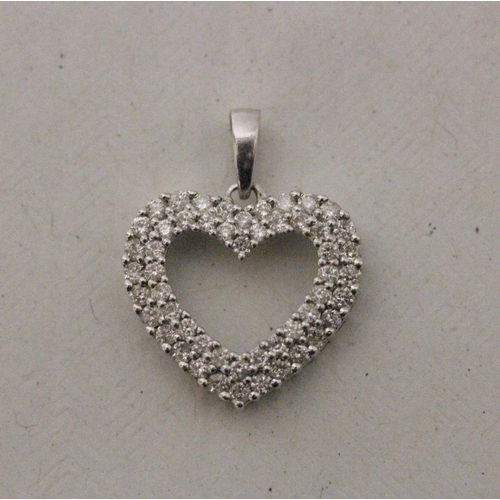 575 - A 9ct modern white gold diamond set open heart pendant, 1.5 grams