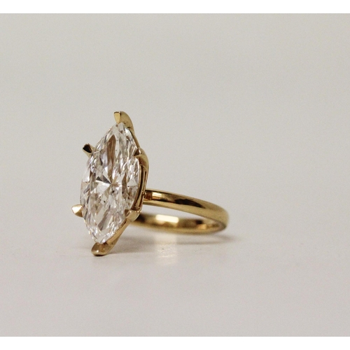 579 - A large and impressive lab grown diamond solitaire ring, the claw set marquise brilliant cut diamond... 