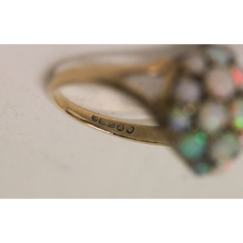 588 - A circular opal bombe cluster dress ring on hallmarked 9ct gold band, ring size N, 3 grams