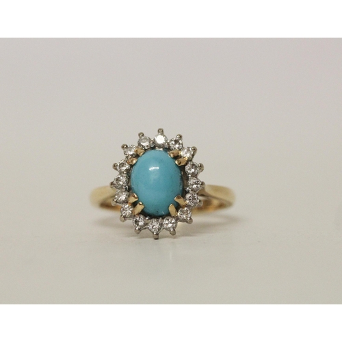 598 - A turquoise and diamond oval dress ring on hallmarked 18ct yellow gold band, ring size O, 5.2 grams