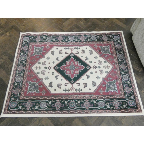 42 - Two red and patterned Axminster rugs