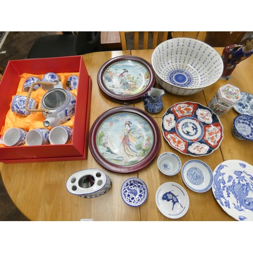 54 - Collectables to include a blue and white Chinese tea set in box, oriental vases, plates and ornament... 