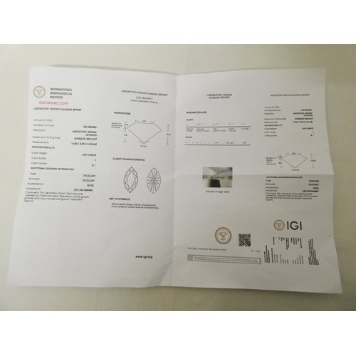 579 - A large and impressive lab grown diamond solitaire ring, the claw set marquise brilliant cut diamond... 