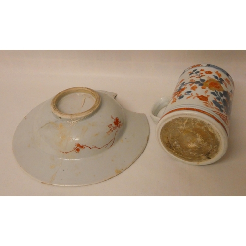 259 - An Imari shaving bowl with riveted restoration and a large Imari tankard (handle restored)