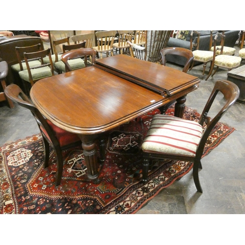 369 - A Victorian mahogany wind-out extending dining table with additional leaf and four balloon backed ch... 