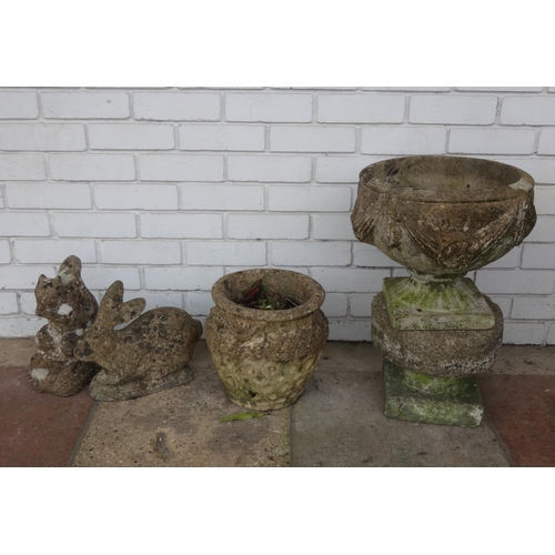 827 - Two concrete animal garden figures and two concrete circular garden planters...