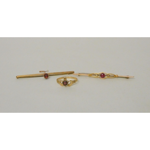 535 - 15ct gold bar brooch with synthetic ruby, another bar brooch set with a garnet and a 9ct gold Cladda... 