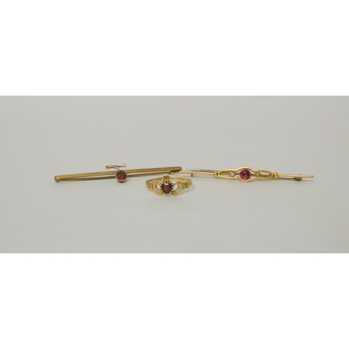 535 - 15ct gold bar brooch with synthetic ruby, another bar brooch set with a garnet and a 9ct gold Cladda... 