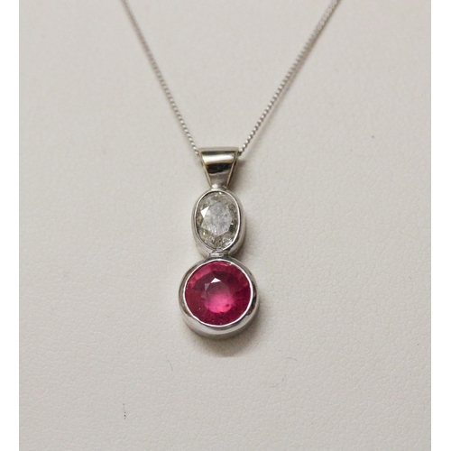 643 - A ruby and diamond pendant, collet set with an oval old cut diamond to a circular ruby, in 9ct white... 