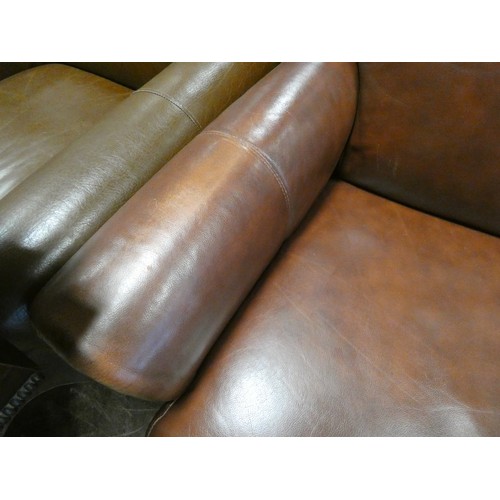 296 - A pair of tan leather easy chairs