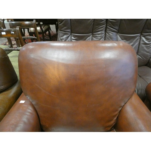 296 - A pair of tan leather easy chairs