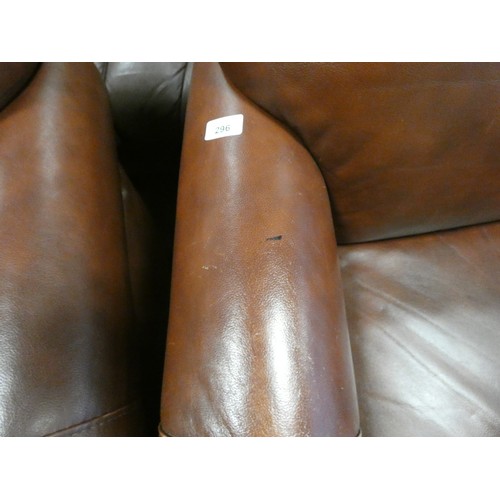 296 - A pair of tan leather easy chairs