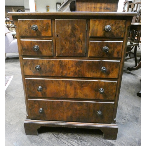 380 - An antique style burr walnut bachelors style chest with an inset brown leather top, widest part 24