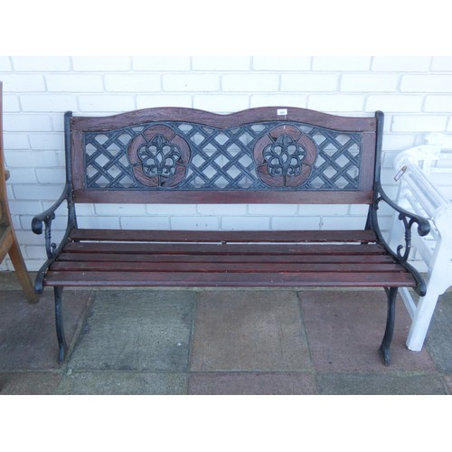 828 - A wrought iron framed two seater garden bench