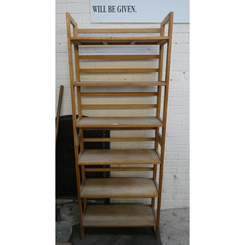 330 - A six tier folding wooden bookcase