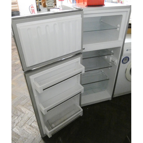 337 - A Liebherr fridge freezer with small freezer compartment on top in silver case