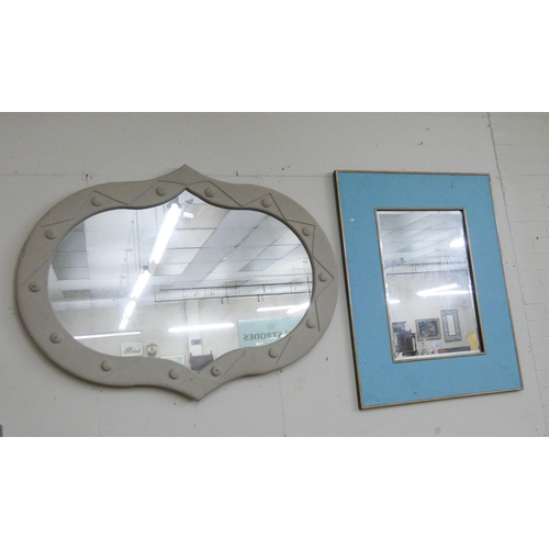 192 - A large shaped wall mirror and another in blue frame