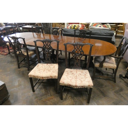 365 - A 1920's solid mahogany triple pedestal extending dining table, and a set of 8 Chippendale style din... 