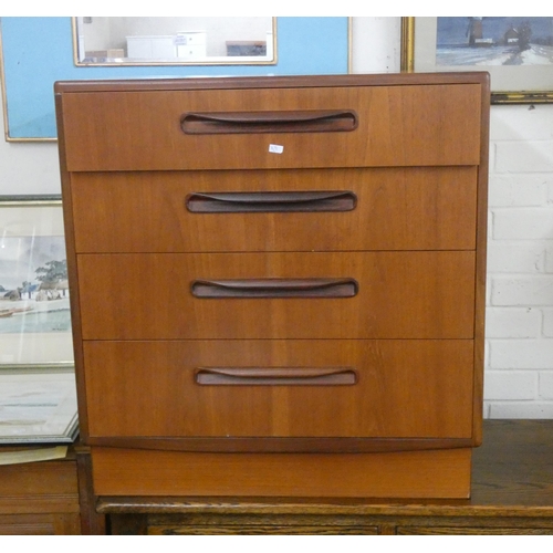 196 - A 1970's teak G-plan chest of four long drawers, 29