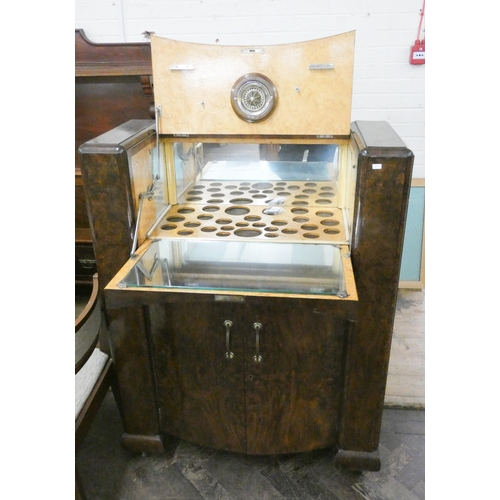 202 - A mid 20th century walnut cocktail cabinet with cupboards under, 3' wide