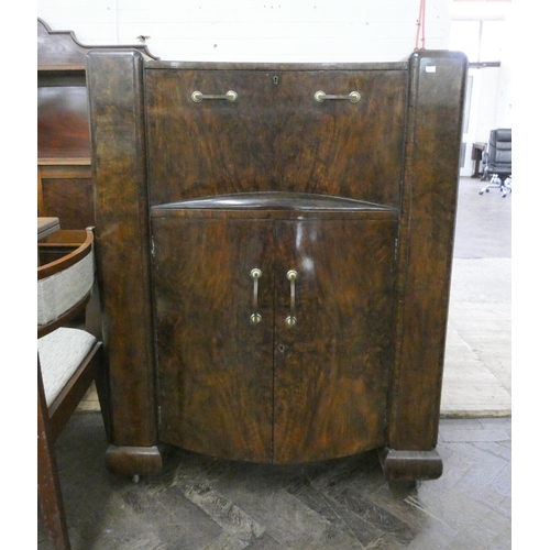 202 - A mid 20th century walnut cocktail cabinet with cupboards under, 3' wide