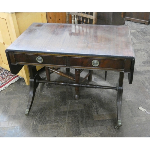 234 - A reproduction mahogany sofa table fitted two drawers standing on a stretcher style base