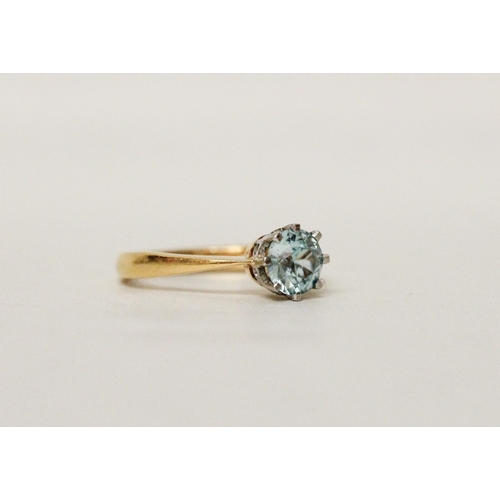 511 - A single stone blue topaz ring on 22ct yellow gold band . Hallmarked, ring size N, gross weight 4.6