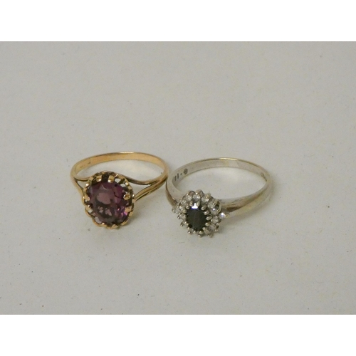 516 - A claw set amethyst single stone ring on 9ct gold band, size N, and a sapphire and diamond oval clus... 