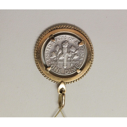 527 - USA Dime mounted as a pendant in 9ct yellow gold mount on fine 9k gold chain. Gross weight of lot - ... 