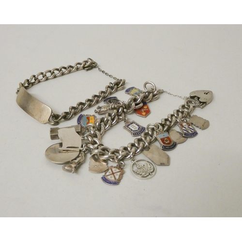 553 - A silver charm bracelet and a silver ID bracelet. Gross weight of 2 - 107g