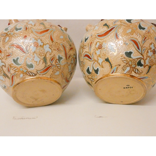 210 - A pair of Doulton Lambeth decorated bulbous shaped jardinières, 9