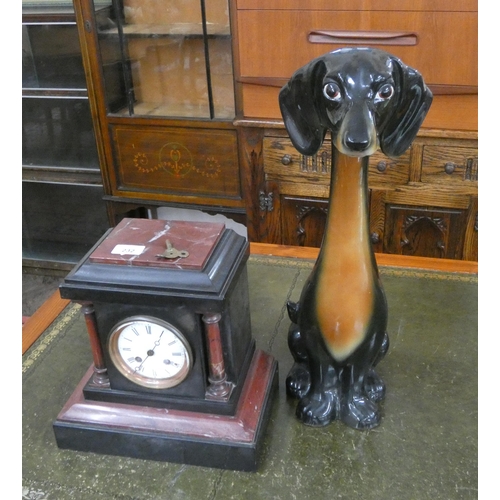 232 - A Victorian striking marble clock and a china dog ornament