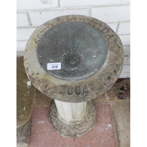 416 - A reconstituted stone garden pillar plant pedestal with added sundial to the top