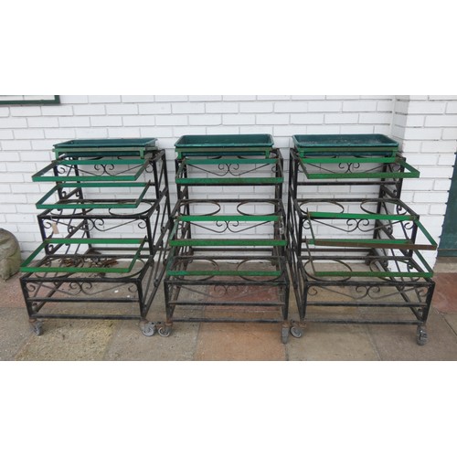 418 - Three wrought iron framed three tiered florist flower bucket holders