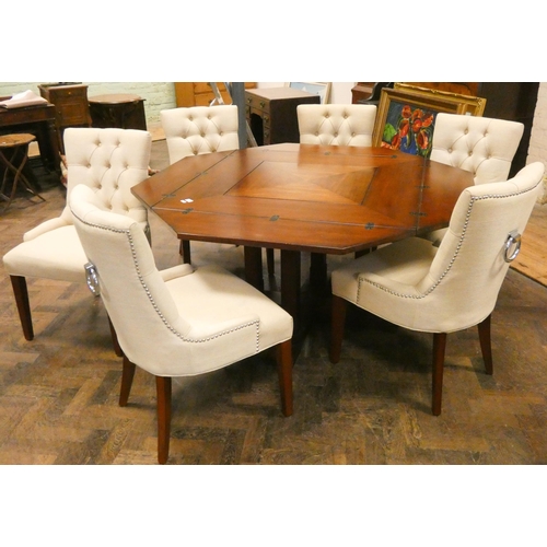 1 - An unusual mahogany octagonal swivel top dining table, with folding leaves to make a square table on... 