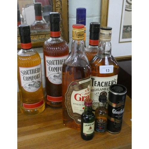 13 - A collection of three bottles of Southern comfort, a Teacher's whiskey, a Grant's whiskey, a bottle ... 