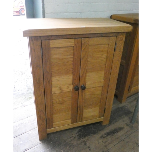 14 - A modern light oak two door cabinet, 28