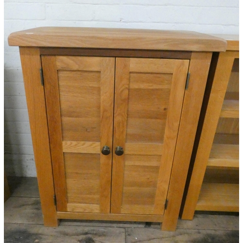 15 - A modern light oak two door cabinet, 28