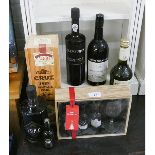 23 - A collection to include a bottle of Cruz 1989 vintage port, bottle of Cockburn's port, another bottl... 