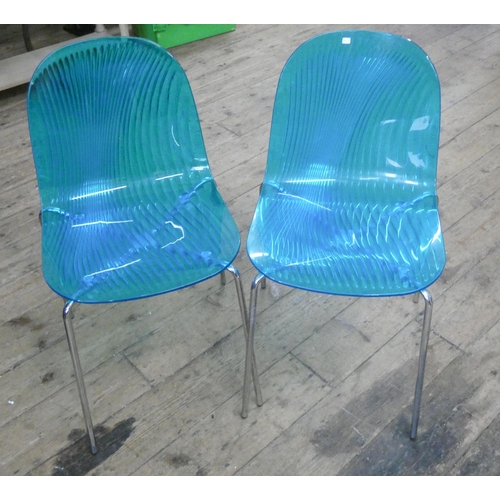 29 - A pair of modern blue acrylic chrome framed dining chairs