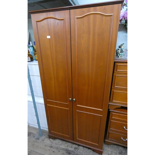 31 - A modern mahogany two door wardrobe, 3' wide