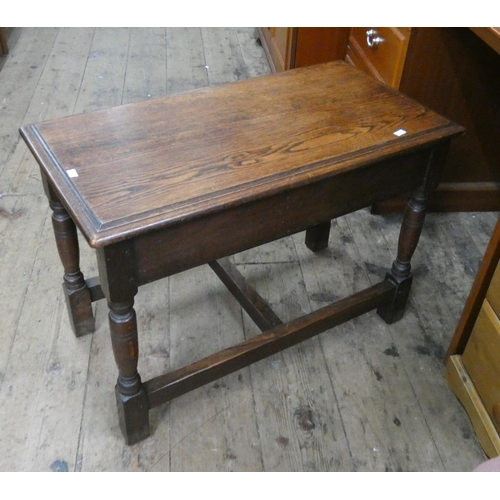 36 - A heavy reproduction oak coffee table