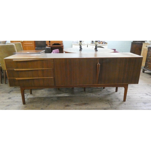 60 - An 1960's/1970's Mackintosh teak long low sideboard fitted three drawers and cupboards, 79