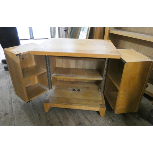 64 - A modern  light oak swivel door CD cabinet