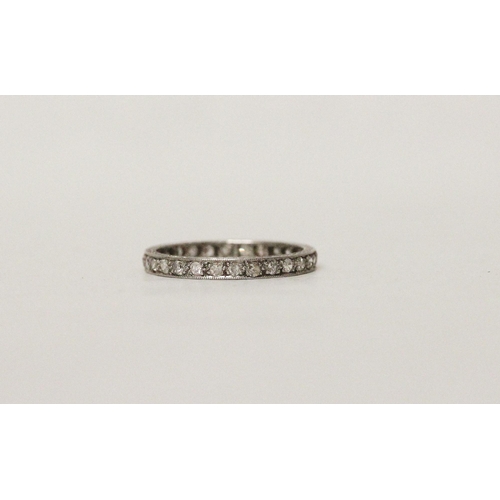 536 - An early 20th century diamond eternity ring, fully diamond set with 28 diamonds in platinum. Ring si... 