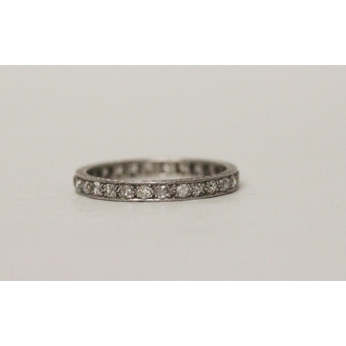 536 - An early 20th century diamond eternity ring, fully diamond set with 28 diamonds in platinum. Ring si... 