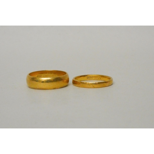 543 - Two 22ct gold wedding bands, gross weight 8.3g, Wide band size L, smaller size K