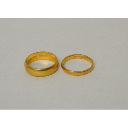 543 - Two 22ct gold wedding bands, gross weight 8.3g, Wide band size L, smaller size K