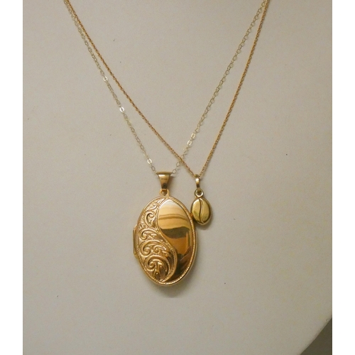 544 - 9ct gold coffee bean pendant on chain and a large oval 9ct gold locket on chain. Gross weight 6.5g